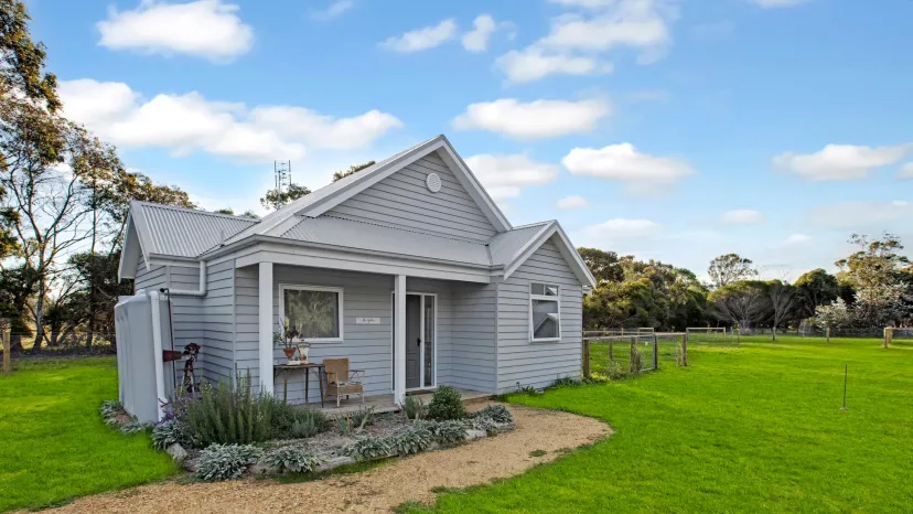 The Gables cottage exterior with its cottage garden and lawn
